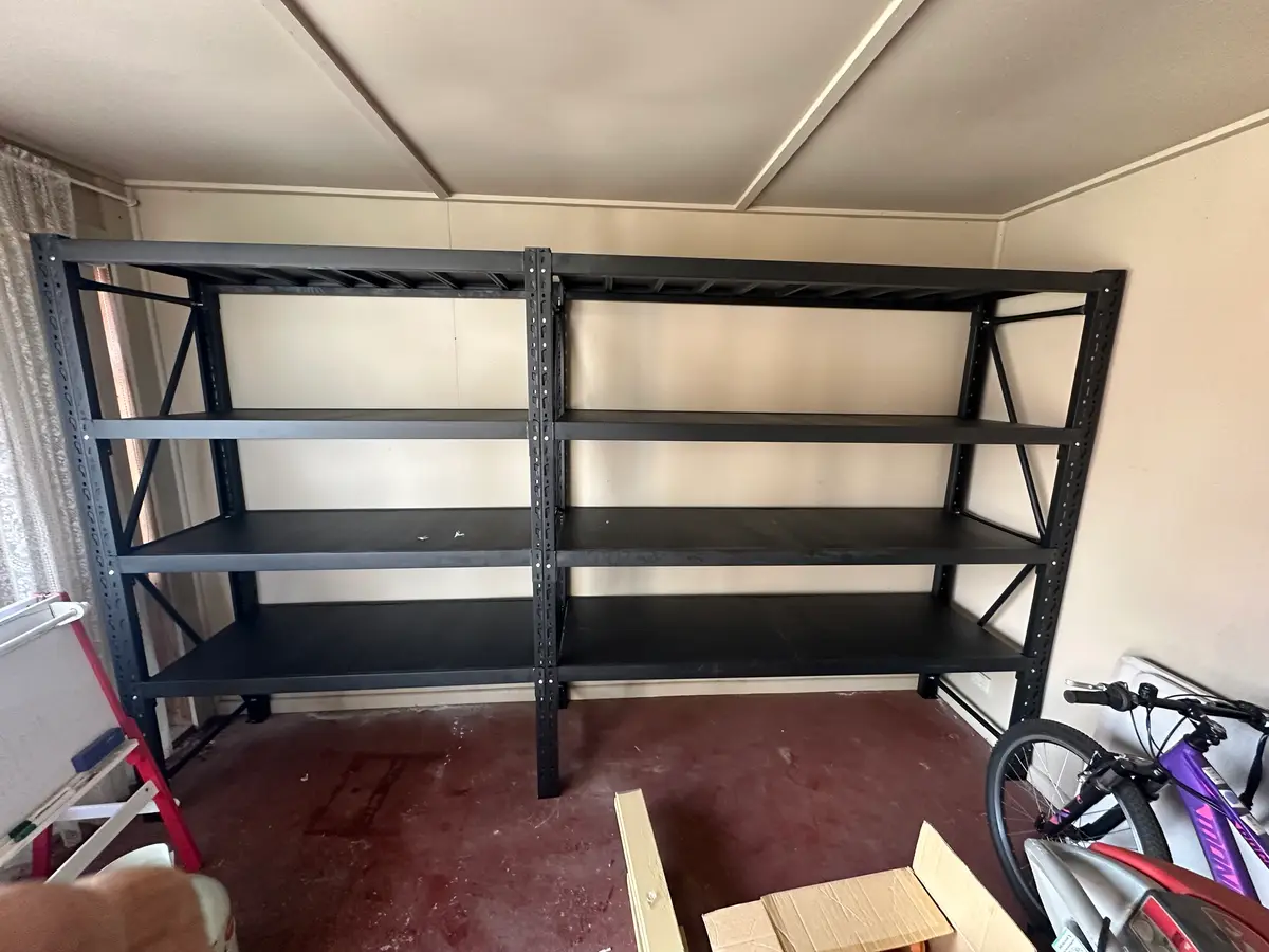 Black metal shelves in a garage room