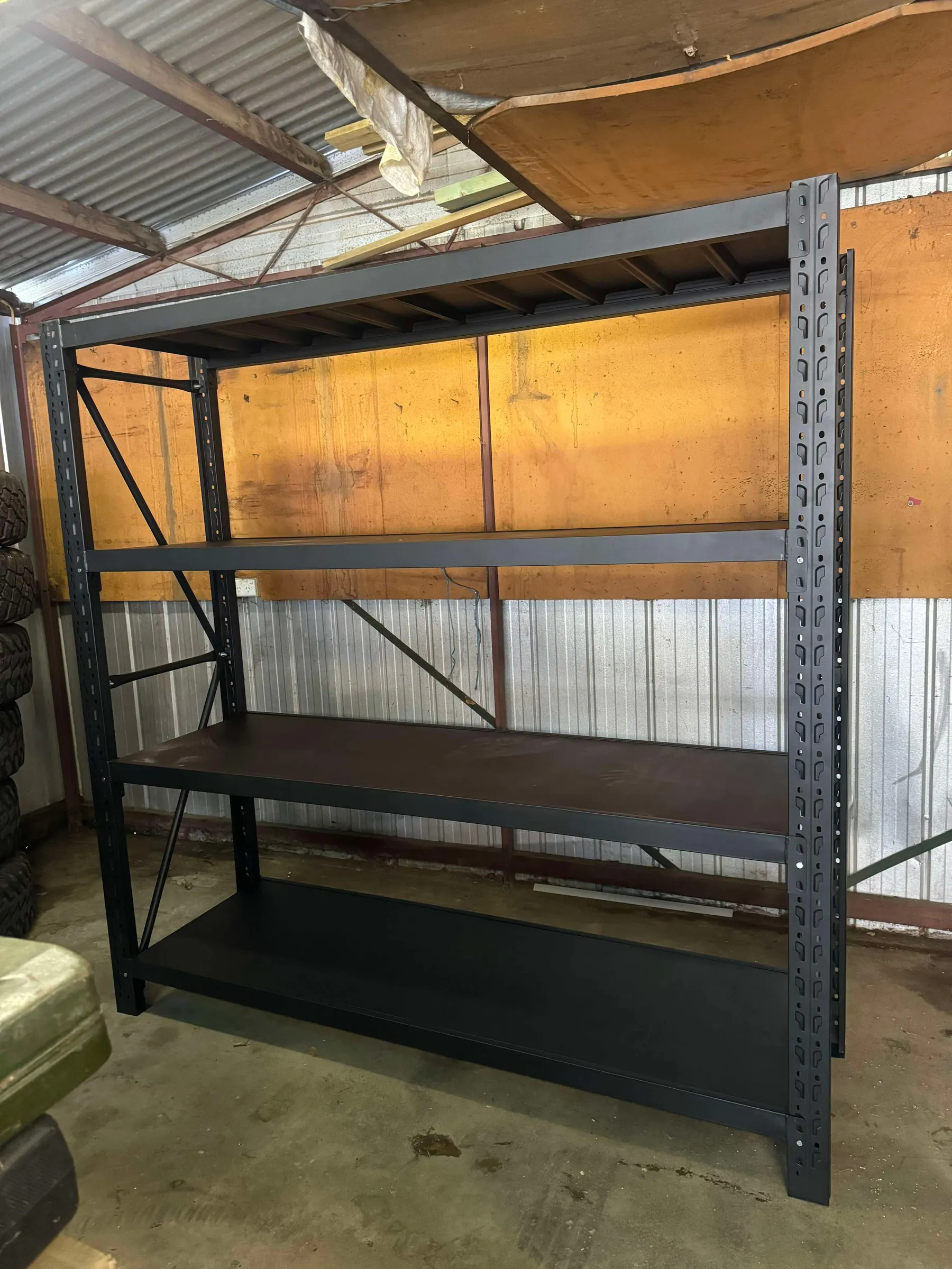 Black metal shelving unit in a garage