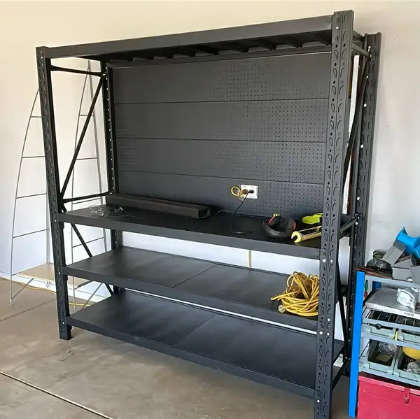 Black metal shelving unit in garage workshop