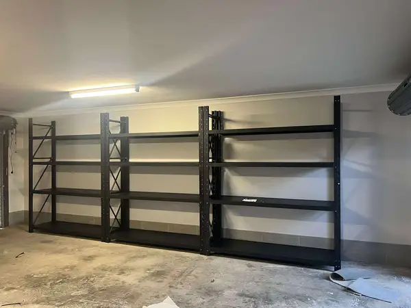 Metal shelves in garage concrete floor space